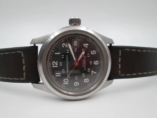 Hamilton Khaki Field acero. Automático. Dial negro. Calendario. Fondo vista. Suiza. 2018