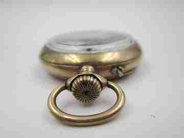 Hebdomas. Metal chapado oro. Volante vista. 8 días cuerda. Dial porcelana. 1900