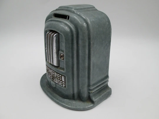 Hucha publicitaria Fonderies Bruxelloises. Hierro, esmalte y metal