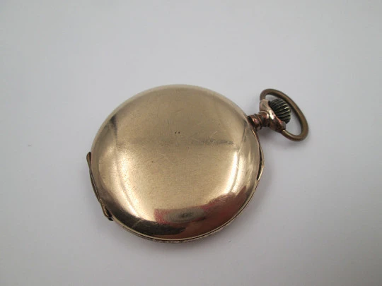 Hunter-case pocket watch. Gold plated metal. Stem winding. Porcelain dial. 1940's. Swiss