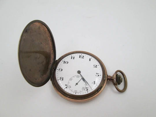 Hunter-case pocket watch. Gold plated metal. Stem winding. Porcelain dial. 1940's. Swiss