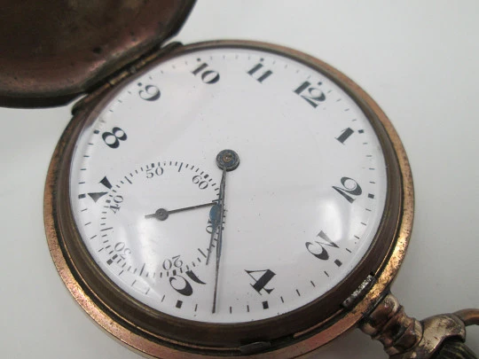 Hunter-case pocket watch. Gold plated metal. Stem winding. Porcelain dial. 1940's. Swiss