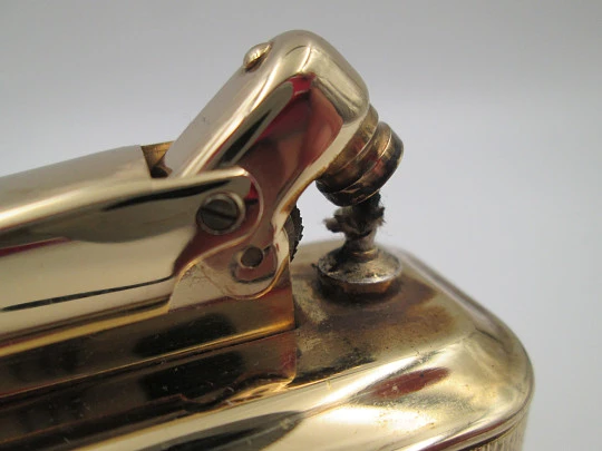 Ibelo Monopol petrol table lighter. Gold plated metal and enamel detail. Germany. 1950's Ibelo Monopol petrol table lighter. Gold plated metal and enamel detail. Germany. 1950's