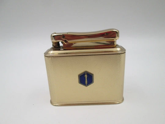 Ibelo Monopol petrol table lighter. Gold plated metal and enamel detail. Germany. 1950's Ibelo Monopol petrol table lighter. Gold plated metal and enamel detail. Germany. 1950's