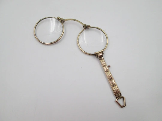 Impertinentes / anteojos plegables para mujer chapados en oro. Adornos geométricos. 1920