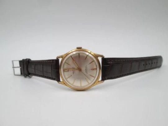 Incitus. Stainless steel & gold plated. Manual wind. Strap. 1960's. Swiss