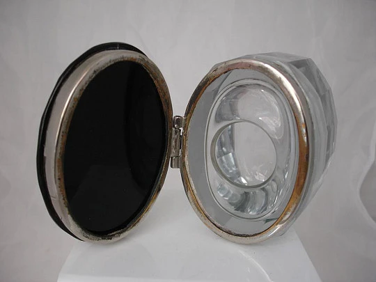 Inkwell. Faceted glass. Oval shape. Black cap. Silver metal. 1940's