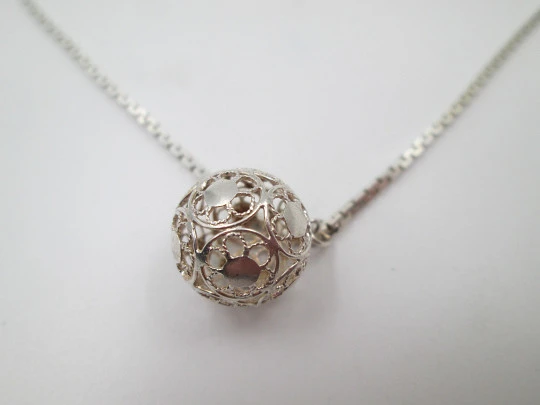 Jewelry women's set. Sterling silver necklace and earrings. Openwork spheres. 1990's
