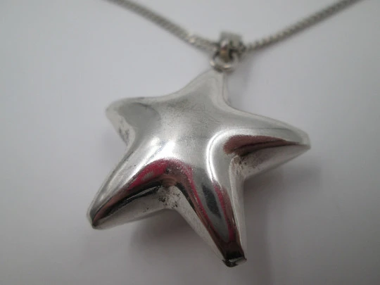 Jingle bell star pendant with braided chain. 925 sterling silver. Spain