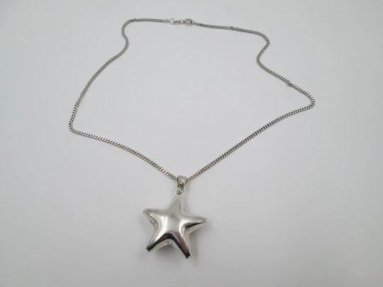 Jingle bell star pendant with braided chain. 925 sterling silver. Spain