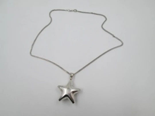 Jingle bell star pendant with braided chain. 925 sterling silver. Spain