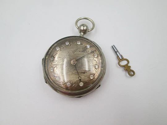 Jn. Ls. Debrit à Genève pocket watch chimes hour quarter. Silver plated. Ornate cooper dial