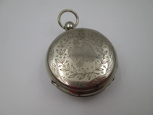 Jn. Ls. Debrit à Genève pocket watch chimes hour quarter. Silver plated. Ornate cooper dial
