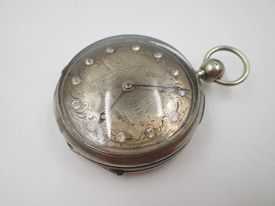 Jn. Ls. Debrit à Genève pocket watch chimes hour quarter. Silver plated. Ornate cooper dial