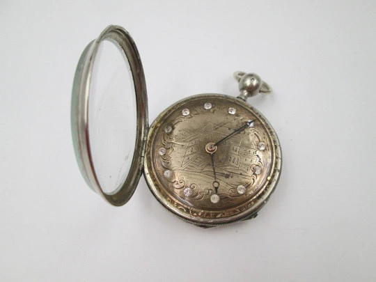 Jn. Ls. Debrit à Genève pocket watch chimes hour quarter. Silver plated. Ornate cooper dial
