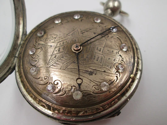 Jn. Ls. Debrit à Genève pocket watch chimes hour quarter. Silver plated. Ornate cooper dial