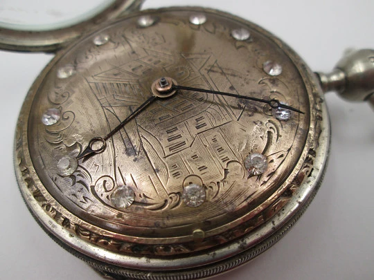 Jn. Ls. Debrit à Genève pocket watch chimes hour quarter. Silver plated. Ornate cooper dial