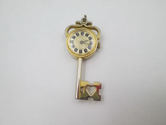 Jubilora pendant watch. Gold plated and steel. Key shape. Manual wind. Swiss. 1970's Jubilora pendant watch. Gold plated and steel. Key shape. Manual wind. Swiss. 1970's