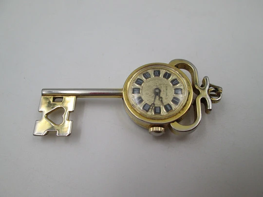 Jubilora pendant watch. Gold plated and steel. Key shape. Manual wind. Swiss. 1970's Jubilora pendant watch. Gold plated and steel. Key shape. Manual wind. Swiss. 1970's