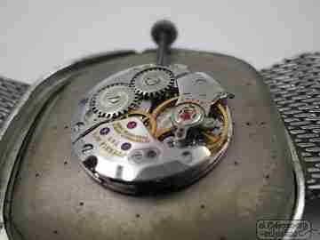 Juvenia Reserve. Acero inoxidable. Cuerda manual. Brazalete malla. 1960