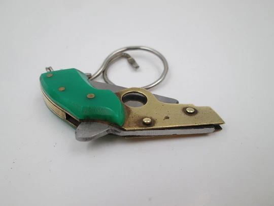 Keychain gun shape pocket knife. Steel, gold plated metal and green resin. 1980's. Spain