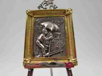 Knife sharpening man miniature picture frame with table tripod. 1990's