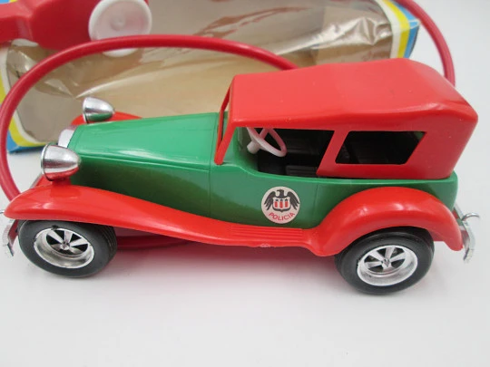 La Paz Toys police car. Colored plastic. Spring and flywheel. 1970's. Spain (Ibi). Original box