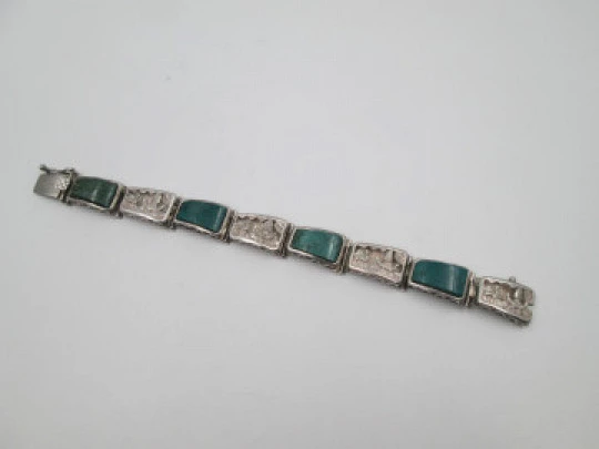 Ladie's articulated bracelet. 925 sterling silver & malachites. Chiseled scenes. Peru. 1980's