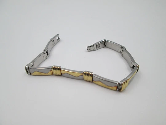 Ladie's articulated bracelet. Stainless steel and 18k gold plated. 1980's