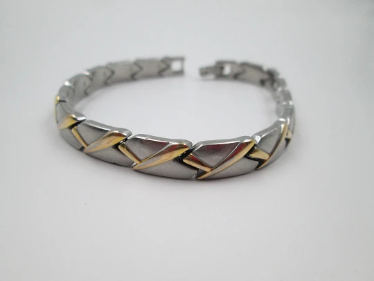 Ladie's articulated bracelet. Stainless steel and gold plated. 1980's