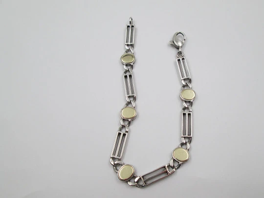 Ladie's articulated bracelet. Sterling silver and rolled gold. Ovals & openwork rectangles