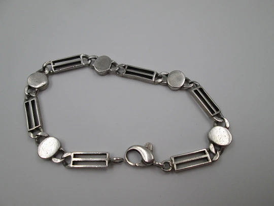 Ladie's articulated bracelet. Sterling silver and rolled gold. Ovals & openwork rectangles