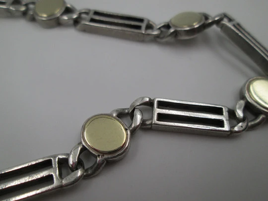 Ladie's articulated bracelet. Sterling silver and rolled gold. Ovals & openwork rectangles