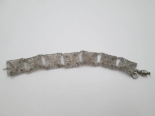 Ladie's articulated filigree bracelet. Sterling silver. Flowers & spheres motifs. Spain. 1950's
