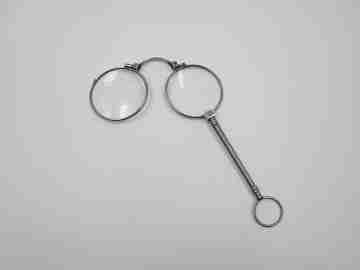 Ladies lorgnette. Folding opera glasses. White metal. 1910's