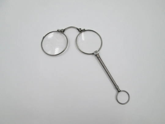 Ladies lorgnette. Folding opera glasses. White metal. 1910's