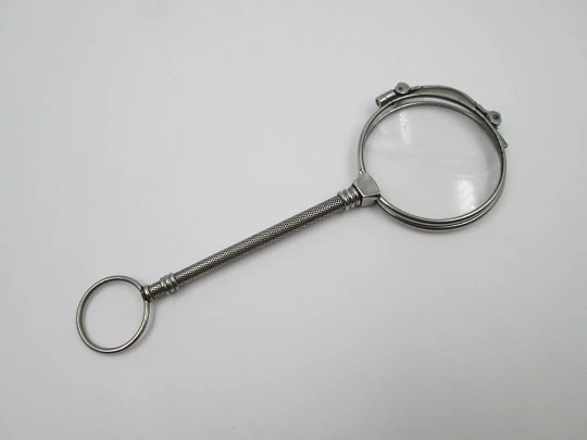 Ladies lorgnette. Folding opera glasses. White metal. 1910's