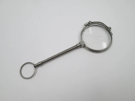 Ladies lorgnette. Folding opera glasses. White metal. 1910's