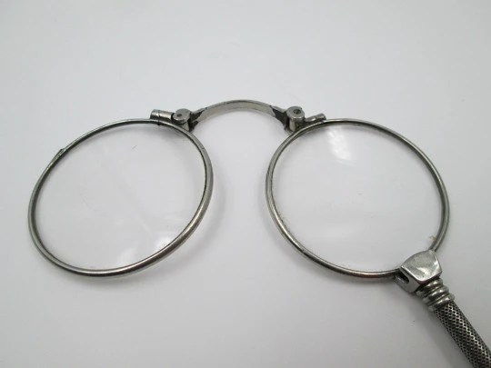 Ladies lorgnette. Folding opera glasses. White metal. 1910's