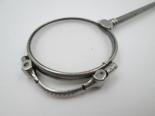 Ladies lorgnette. Folding opera glasses. White metal. 1910's