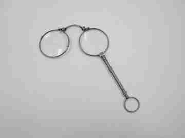 Ladies lorgnette. Folding opera glasses. White metal. 1910's