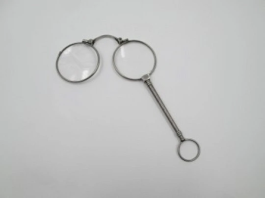 Ladies lorgnette. Folding opera glasses. White metal. 1910's