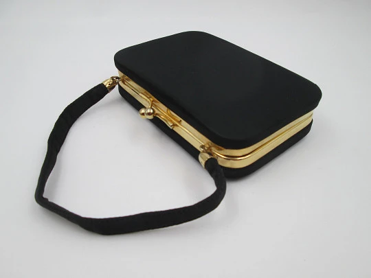 Ladie's vanity bag with top handle. Black silk and gold plated metal. Balls clasp. 1960's