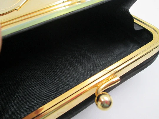Ladie's vanity bag with top handle. Black silk and gold plated metal. Balls clasp. 1960's