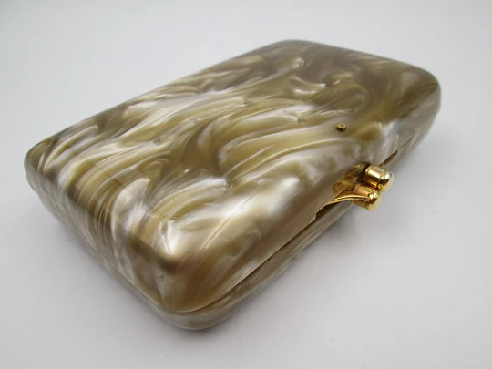 Ladie's vanity handbag. Marble celluloid and gold plated metal. United States. 1950's