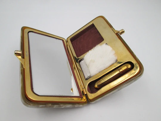 Ladie's vanity handbag. Marble celluloid and gold plated metal. United States. 1950's