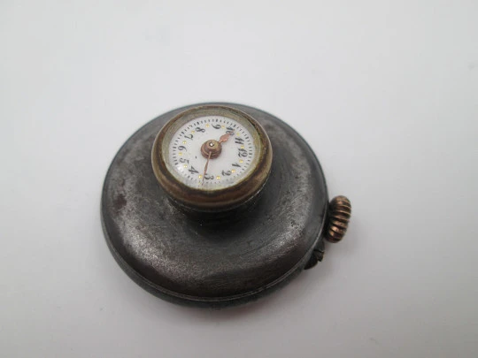 Lapel watch. Iron & gold plated metal. Stem-wind / pin-set movement. 1890's. Swiss