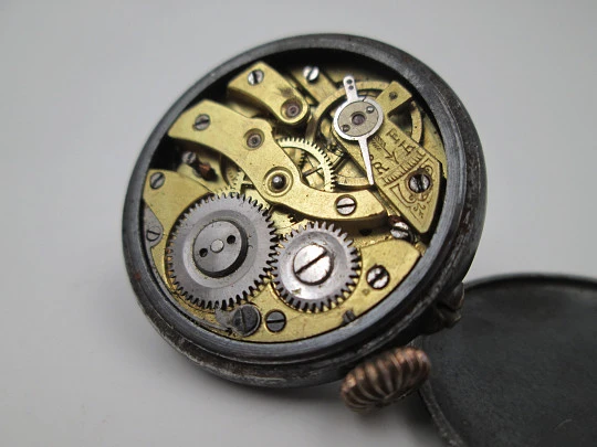 Lapel watch. Iron & gold plated metal. Stem-wind / pin-set movement. 1890's. Swiss