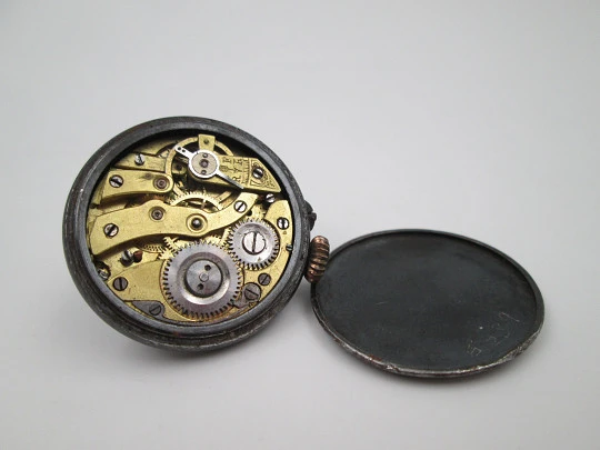 Lapel watch. Iron & gold plated metal. Stem-wind / pin-set movement. 1890's. Swiss