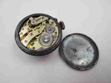 Lapel watch. Iron & gold plated. 1890's. Stem-wind. Pin-set. White dial